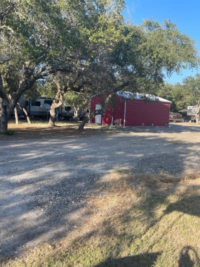 The red barn and overflow parking area at New Season RV Resort, Aransas Pass TX