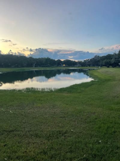 The fishing pond and dock at dusk, New Season RV Resort, Aransas Pass TX